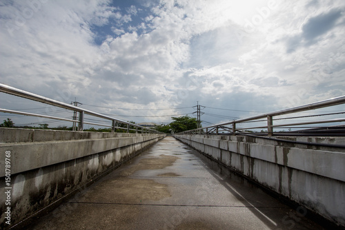 Pedestrian overpasses are built to provide safety for those who want to cross the road while cars below are using the road at high speed. Pedestrian overpasses lead people to their destinations safely