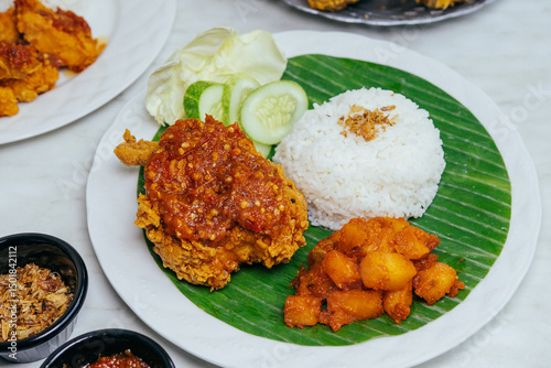 indonesian ayam geprek with sambal and chili potato 