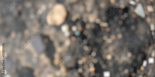 A blurry image of a ground surface with small rocks and debris scattered across the area view