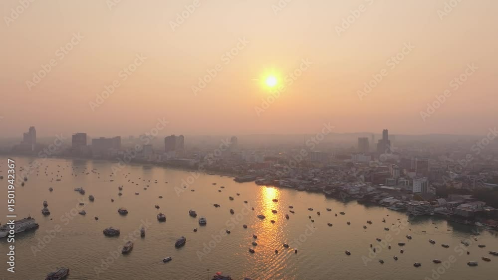 Coastal hotels and quiet waves seen from above Pattaya, Thailand. Aerial drone video