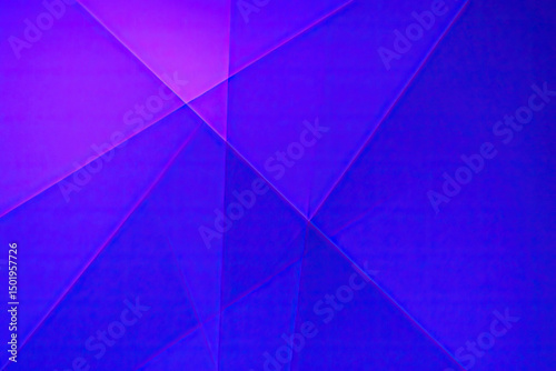  Abstract geometric background with overlapping triangles in purple and blue hues, creating depth and a layered digital texture.