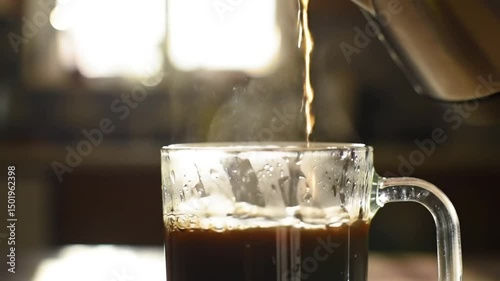 Pouring coffee into glass mug fresh brew morning beverage hot drink caffeine boost daily ritual coffee time