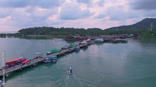 Tranquil floating homes and fishing boats near Bang Bao Pier, Thailand. Aerial drone video