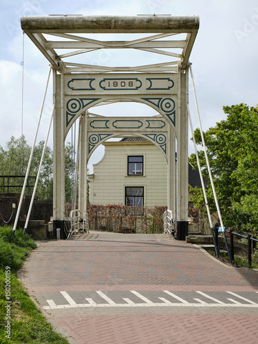 Historic iron drawbridge over the lock at Strijensas in the Hoeksche Waard photo