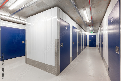 Modern self-storage facility corridor with blue doors