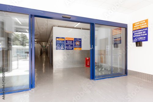 Entrance to a modern self-storage facility with sliding doors