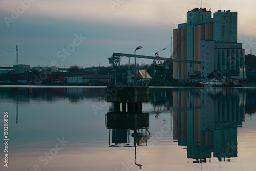Factory at a river during evening