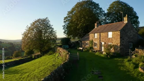 Charming Stone Cottage Nestled Within Rolling Green Hills Of Countryside
