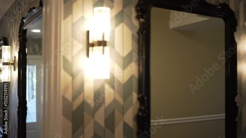 Interior Design Modern Hallway Featuring Mirrors Sconces And Geometric Wallpaper