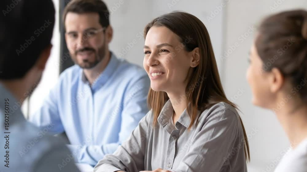 Smiling businesswoman having conversation during business meeting in the office space Smiling businesswoman having conversation during business meeting in the office space