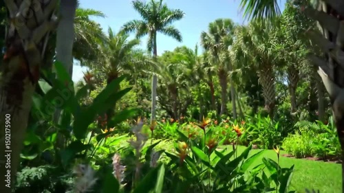 Lush Tropical Paradise With Colorful Blooms And Swaying Palm Trees