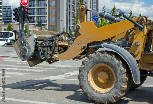 Front loader industry construction machine outside on urban street