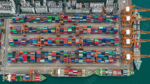 Low angle View of business logistic import and export freight transportation by container ship, Time Lapse, Container ship loading and unloading in deep sea port, 4k video, aerial view,