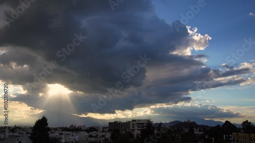 Horizontal video of mountains in silhouette and clouds with beautiful sunbeams