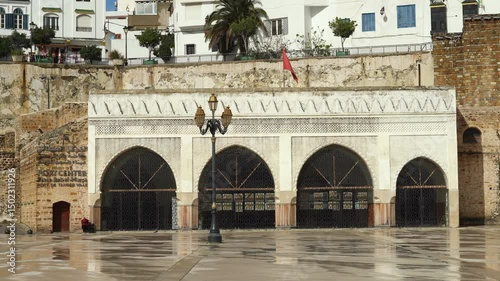The grand entrance of Bab El Marsa in Tangier, Morocco, offers a stunning view of the sea, blending history with the beauty of the coastline