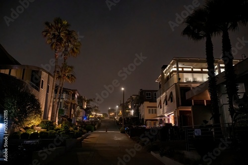 Fototapeta Naklejka Na Ścianę i Meble -  Looking up the roads and paths of small beach town neighborhoods, showing various styles of homes during late evening hours. 