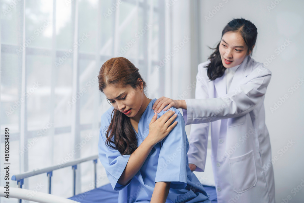 Female doctor examining shoulder of young patient suffering from pain, healthcare and medical concept Female doctor examining shoulder of young patient suffering from pain, healthcare and medical concept
