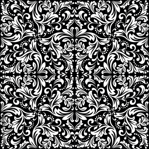 Wallpaper in the style of Baroque. White and black floral ornament. Seamless vector background. Graphic pattern for fabric, wallpaper, packaging. Ornate Damask flower illustration.