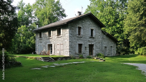 Obraz na płótnie Stone house nestled in lush greenery, featuring stone steps and shutters w salonie