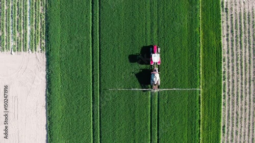 Aerial View of Tractor in Green Field