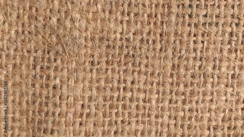 Close-up of fabric woven from burlap. Natural burlap texture photo. 