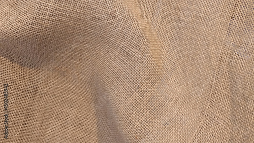 Close-up of fabric woven from burlap. Sackcloth textured background. 