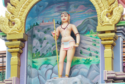 Photography Skanda Murugan as Kanda Swami - Hindu deity sculpture in a temple niche on the r