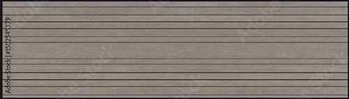 A close-up of a textured gray surface with horizontal grooves