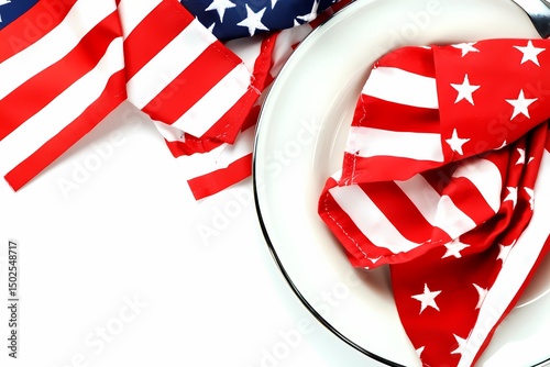 Patriotic American flag napkin elegantly folded on a white plate ready for a celebratory meal showcasing red white and blue crisp clean image
