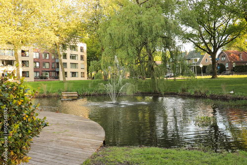 Fountain park garden in city neighborhood pond water explore relaxing view point.