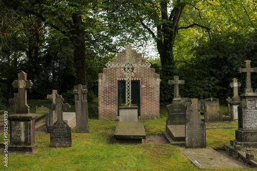 Graveyard tombstone cemetery Christian cross religion faith garden park. Church building shed.