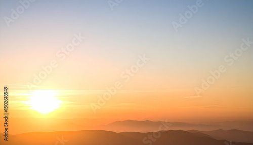 Warm Sunset Over Hazy Hills