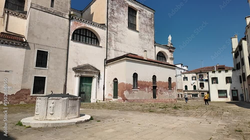 Venice, Italy - May 12, 2025 - Tourists visit the historic center of the lagoon city Venice, Italy - May 12, 2025 - Tourists visit the historic center of the lagoon city