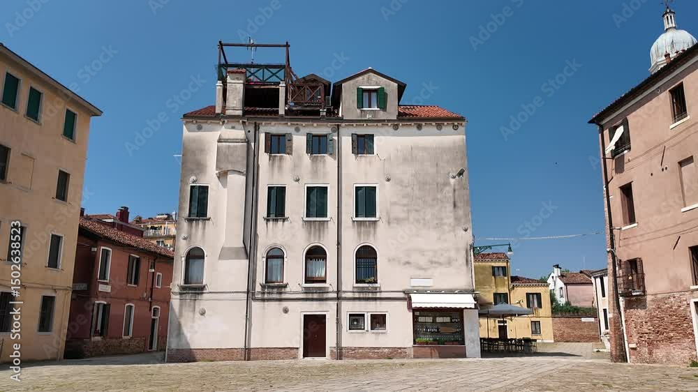 Venice, Italy - May 12, 2025 - Tourists visit the historic center of the lagoon city Venice, Italy - May 12, 2025 - Tourists visit the historic center of the lagoon city