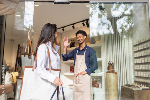 Shopper greeting in a stylish bag store