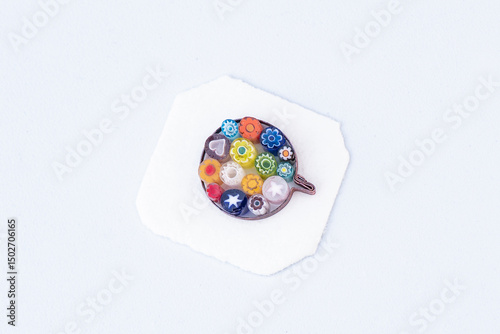 Colorful glass mosaic pendant on white background