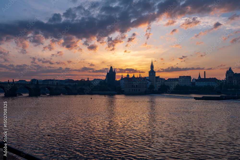 Naklejka premium Prague, Czech Republic - 05.01.2025 - the old town city center of prague, charles bridge during sunrise