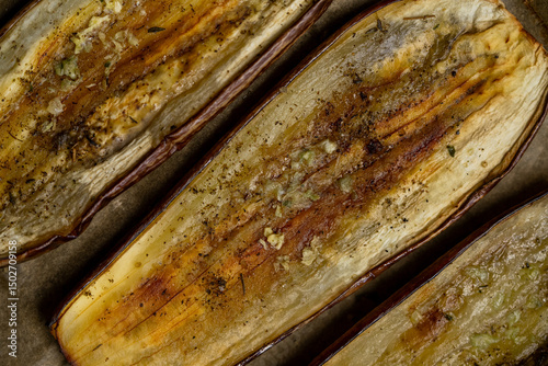 Oven roasted eggplant slices with rustic texture photo