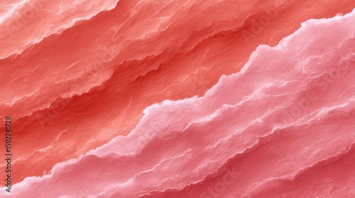 Close-up of torn pink and peach textured paper with layered edges for background or design