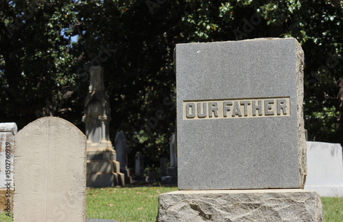 Words Our Father Engraved on Headstone Death Concept