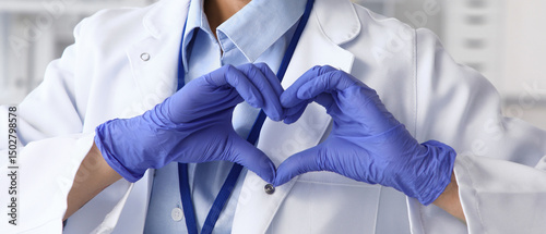 Female doctor making heart ...
