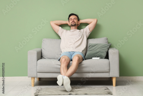 Relaxed young man resting o...