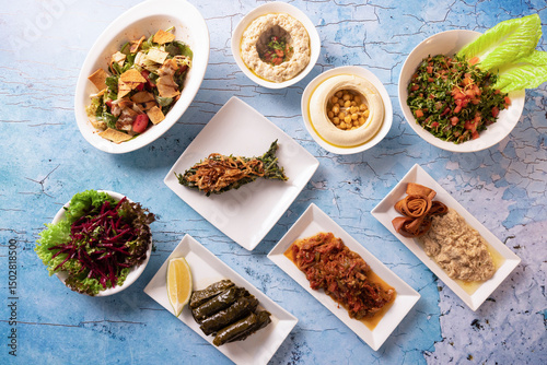 Traditional Lebanese mezze spread with colorful salads, dips, and appetizers.
