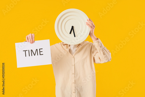 Woman holding paper with word TIME and wall clock on yellow background