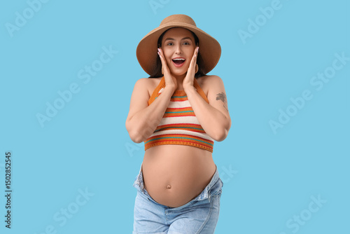 Surprised young pregnant wo...