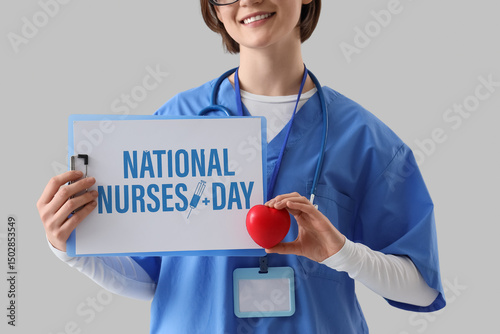 Female doctor holding clipb...