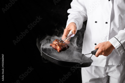 Chef cooking grilled steak ...