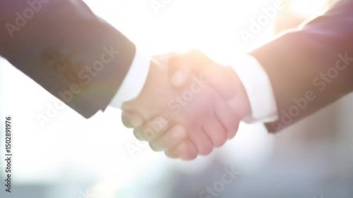 Successful business handshake as corporate partnership agreement shows unity and success