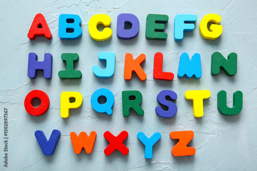 Naklejka premium English alphabet on blue background