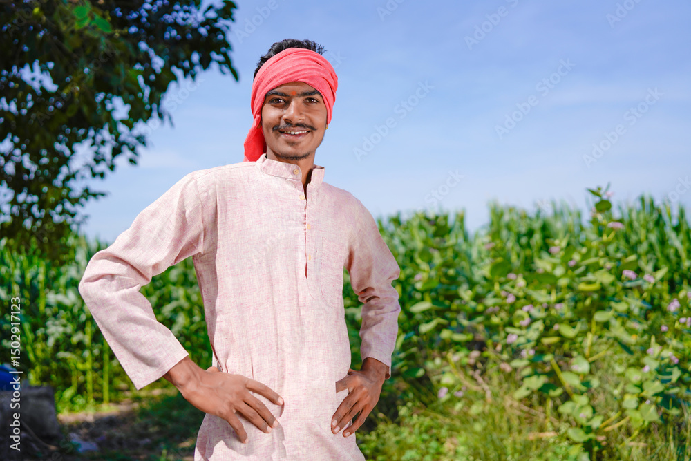 Fototapeta premium indian farmer standing confidently at agriculture field